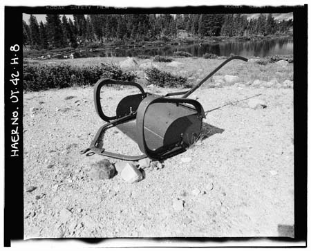 HAER photo of steel, stock-drawn earth scraper used to scrape earth, borrow material and transport it to Five Point Lake Dam during construction, July 1985